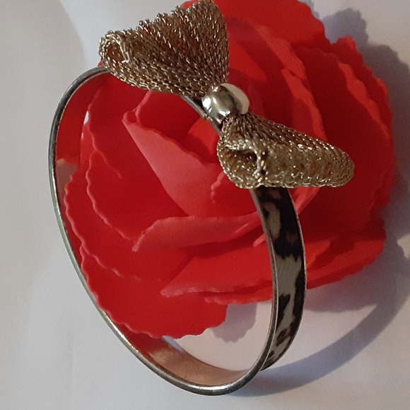 Source Unknown Jewelry - Animal print with a gold bow bracelet